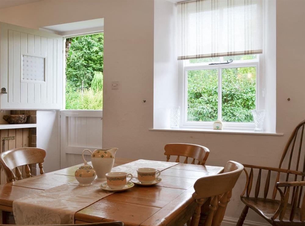 Convenient dining area within large kitchen at Roundhill Cottages 1 in Ambleside, Cumbria