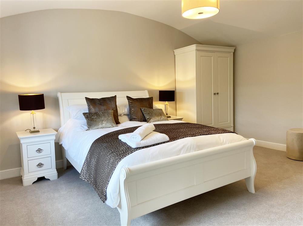 Pontesford bedroom with 5’ king-size bed at Roundton House, Montgomery