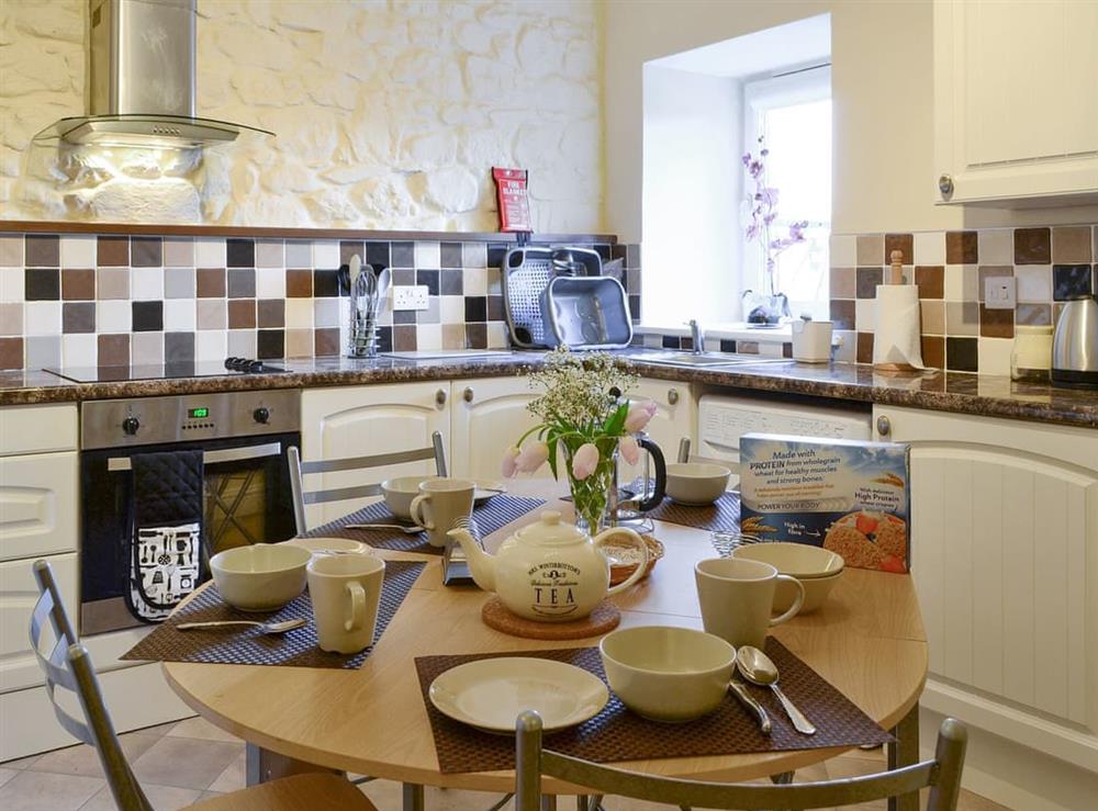 Informal dining area within the kitchen at Cedar Lodge, 