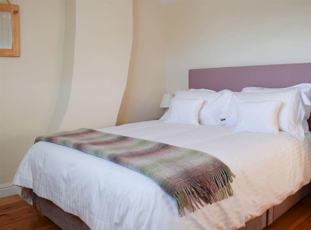 Cosy and inviting double bedroom with kingsize bed at Rowan Cottage in Aislaby, near Whitby, Yorkshire, North Yorkshire
