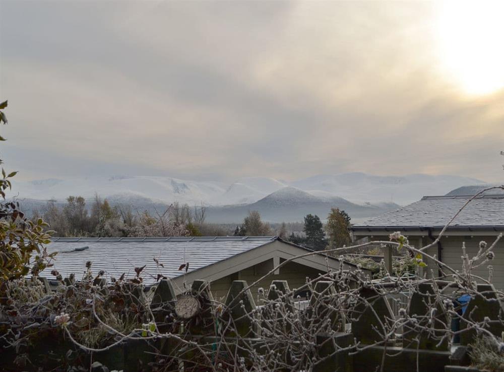 Stunning views towards the mountains from the garden at Rowan Cottage in Aviemore, Inverness-Shire