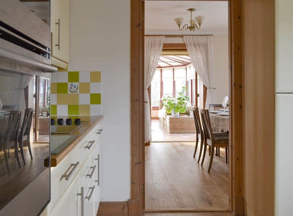 Well-equipped fitted kitchen at Rowan Cottage in Aviemore, Inverness-Shire