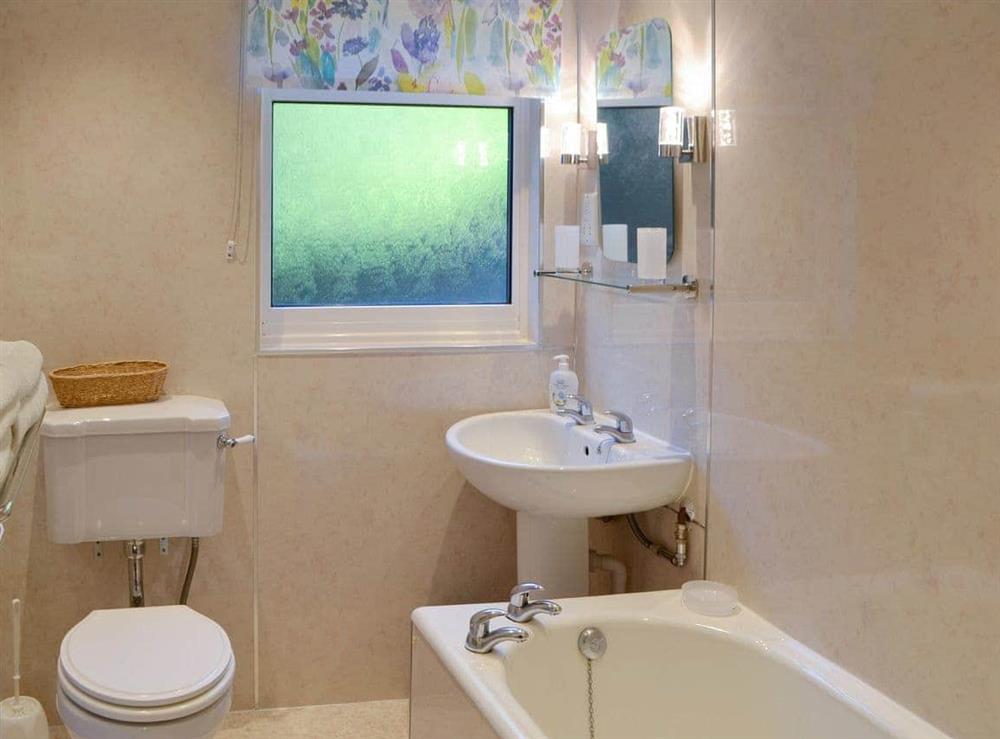 Family bathroom with shower over bath at Rowan Cottage in Byrness Village, near Otterburn, Tyne And Wear