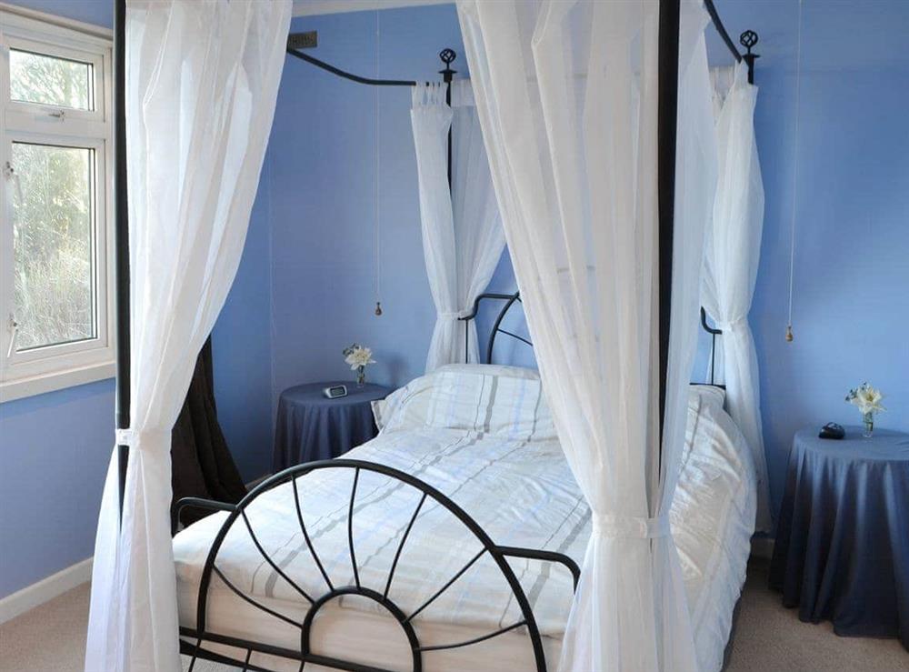 Relaxing four poster bedroom at Rowan Cottage in Byrness Village, near Otterburn, Tyne And Wear