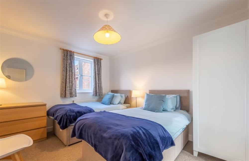 First floor: Bedroom two with twin 3ft single beds at Rowan Cottage, Holt