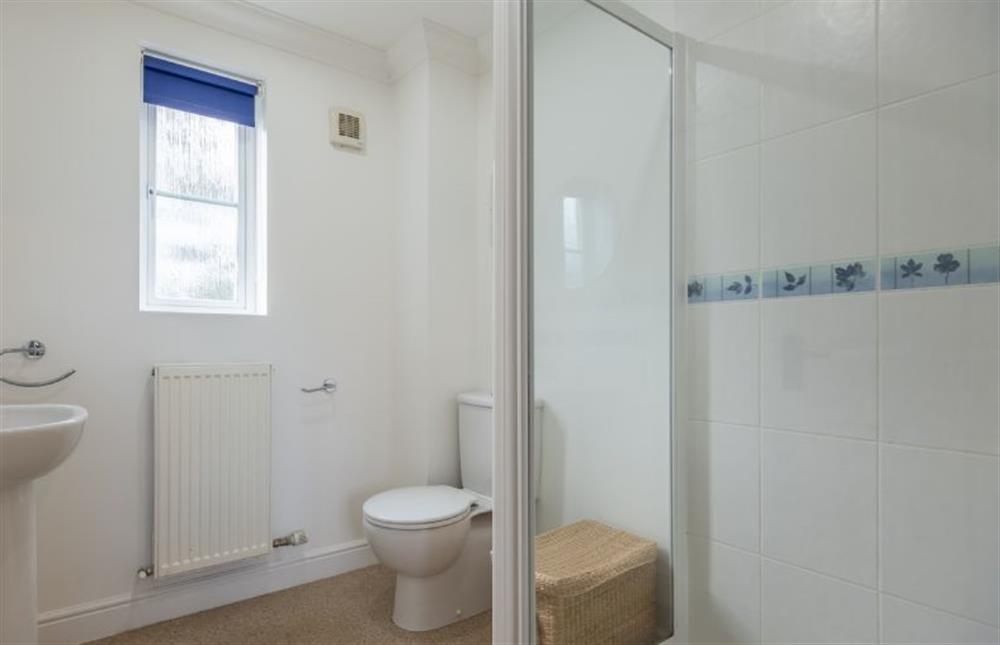 First floor: En-suite with shower, wash basin and WC at Rowan Cottage, Holt