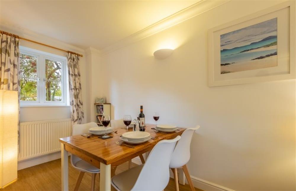 Ground floor:  Dining room area with dining table with seating for four guests at Rowan Cottage, Holt