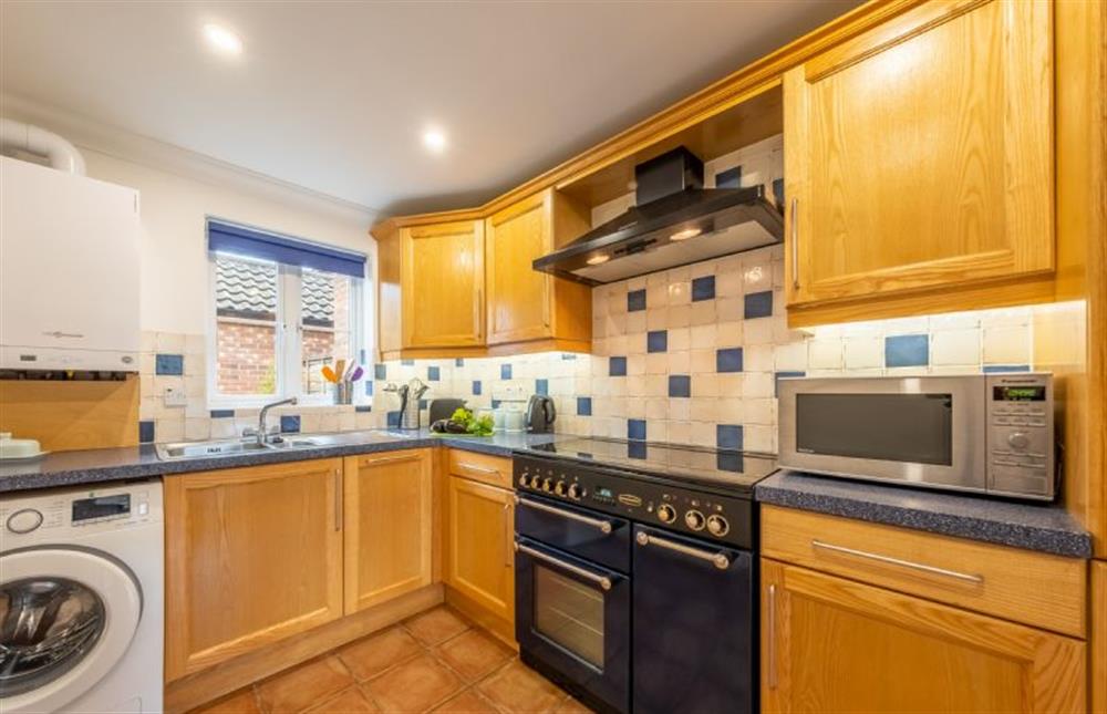 Ground floor: Kitchen with gas Rangemaster, microwave, slimline dishwasher, fridge-freezer and washing machine
