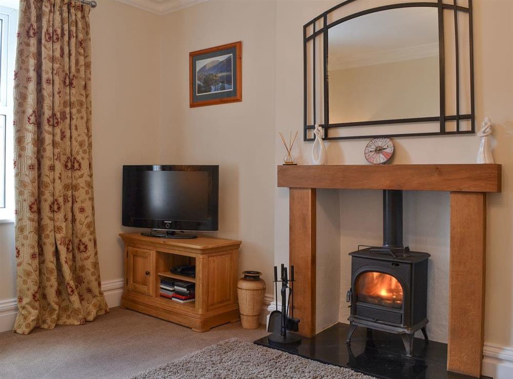 Living room with wood burner at Rowan House in Threlkeld, near Keswick, Cumbria