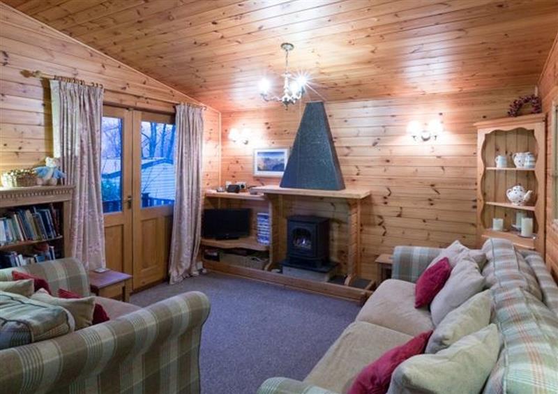 Relax in the living area at Rowan Lodge, Pinewood 16
