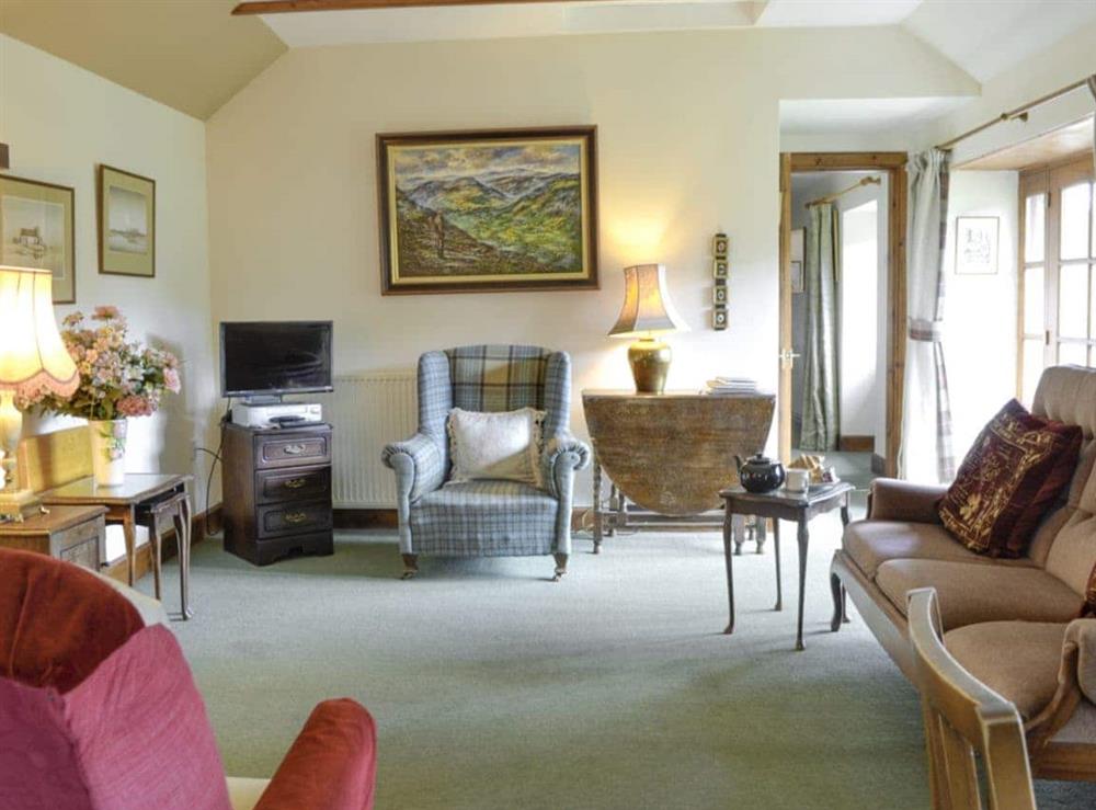 Welcoming open-plan living space at Rowan Tree Cottage in Blairgowrie, Perthshire