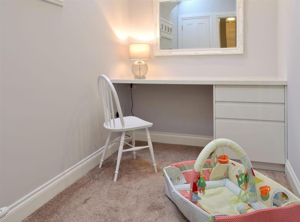 Convenient dressing room/ nursery with travel cot