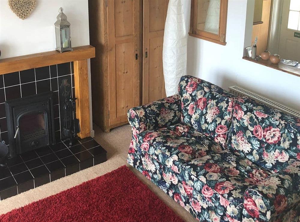 Cosy living room with wood burner at Ruach in Gardenstown, near Macduff, Aberdeenshire
