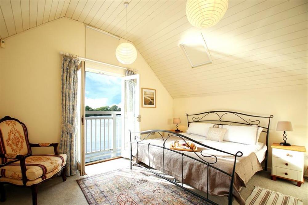 Bedroom with lake views at Ruddy Duck Lake House, Nr Cirencester, Gloucestershire