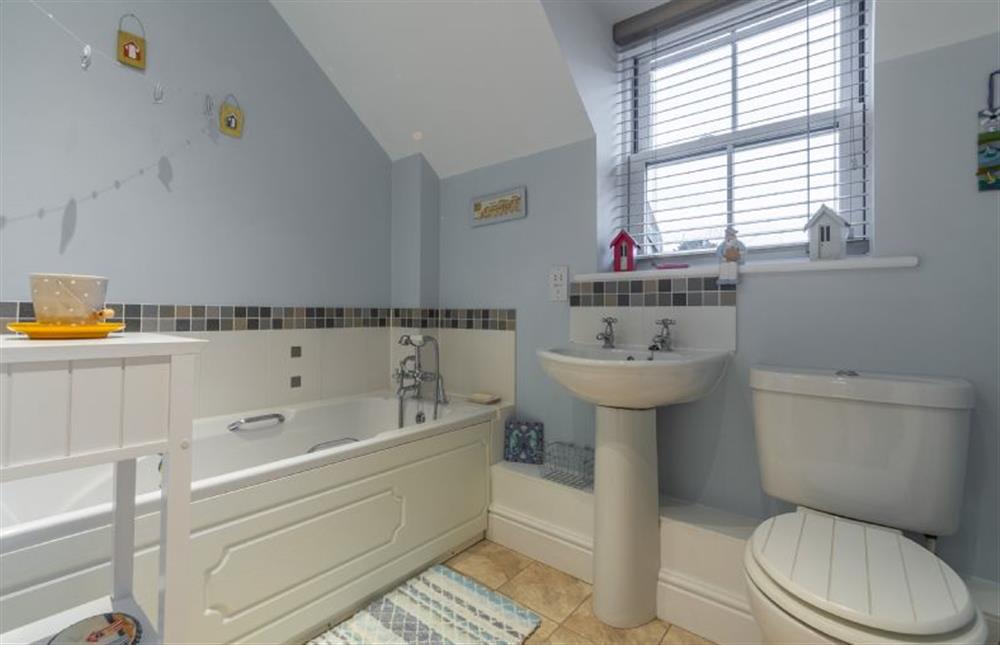 First floor: Light and airy family bathroom at Rufus Cottage, Dersingham near Kings Lynn