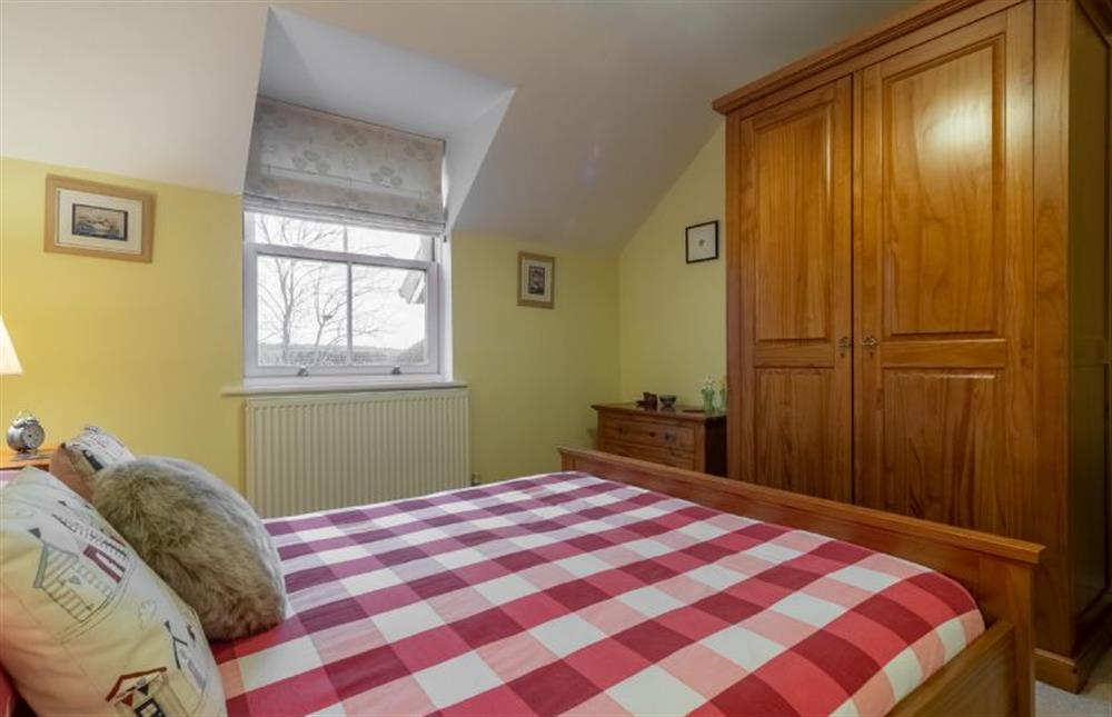 First floor: Master bedroom with a double bed at Rufus Cottage, Dersingham near Kings Lynn