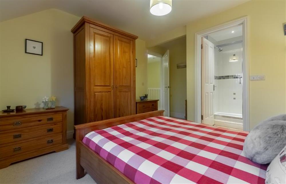 First floor: Master bedroom with en-suite shower room at Rufus Cottage, Dersingham near Kings Lynn