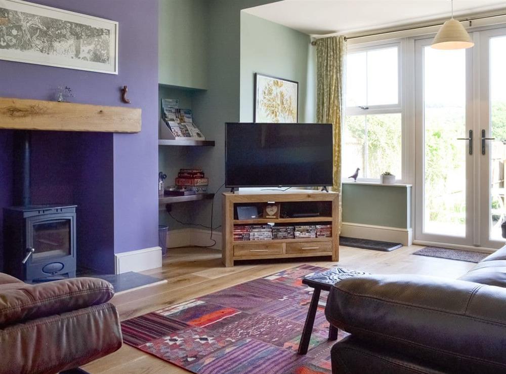Attractive living room with French doors to patio and garden at Running Hare in Windermere, Cumbria
