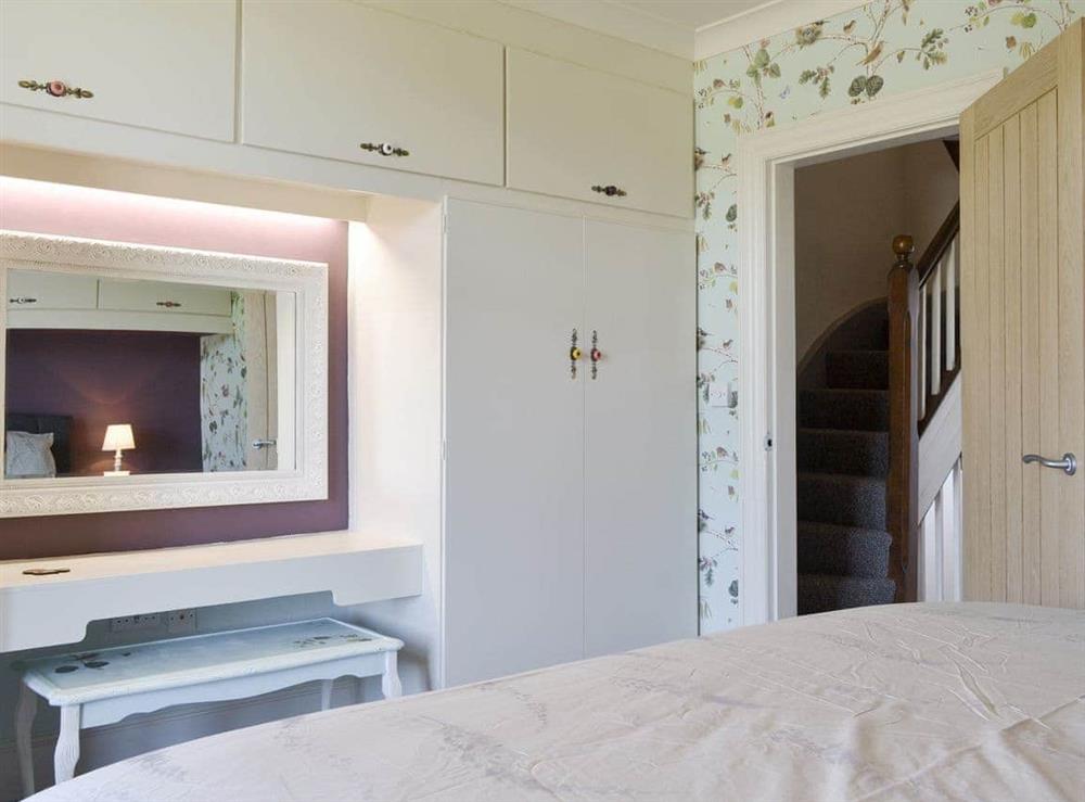 Useful built-in storage in second bedroom at Running Hare in Windermere, Cumbria