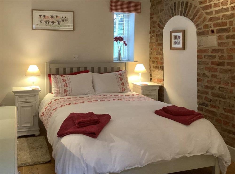 Comfortable double bedroom at Rusty’s Cottage in Buttercrambe, near York, North Yorkshire