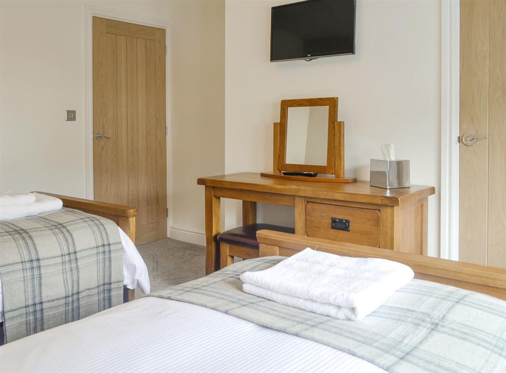 Comfortable twin bedroom at Rydal Cottage in Keswick, Cumbria