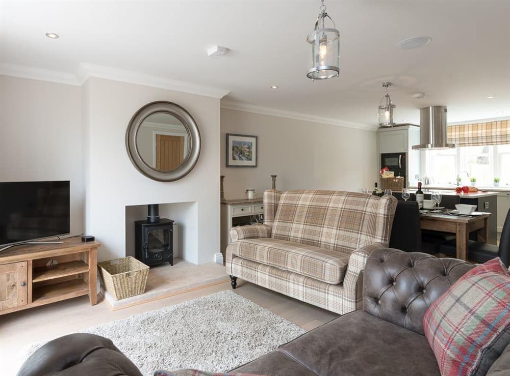 Contemporary furnished living room with wood burner at Rye Cottage in Helmsley, Yorkshire, North Yorkshire