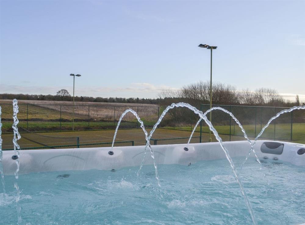 Wonderful hot tub overlooking the tennis court at Ryelands House in Potterhanworth, near Lincoln, Lincolnshire