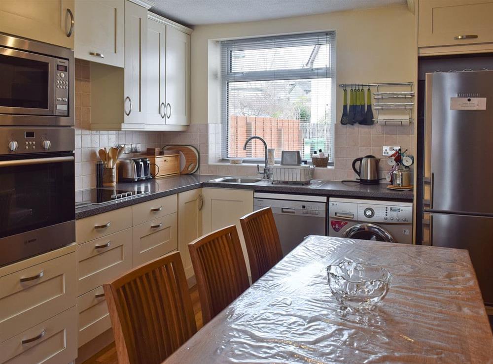 Open plan living/dining room/kitchen (photo 3) at Saddleback Cottage in Keswick, Cumbria
