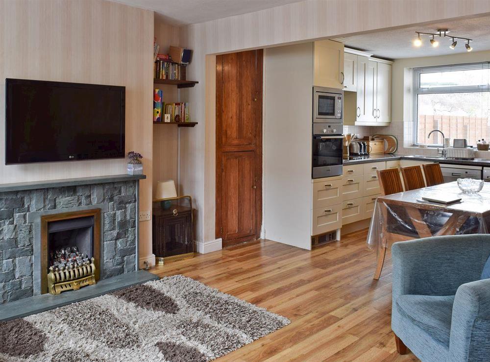 Open plan living/dining room/kitchen at Saddleback Cottage in Keswick, Cumbria