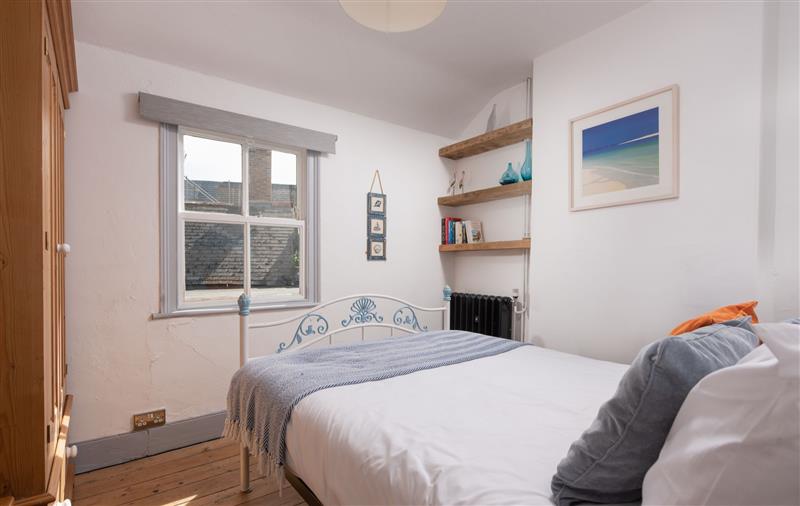 This is a bedroom (photo 2) at Saffron Cottage, Cornwall
