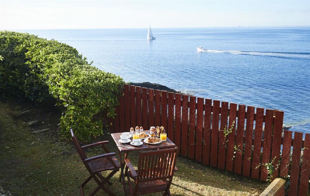 Patio with garden furniture and magnificent views (photo 2) at Sally Port Cottage, St Anthonys Lighthouse