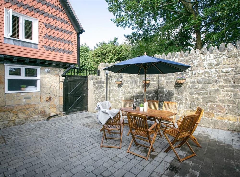 Enclosed patio area with outdoor furniture at Salomons Country Cottage in Tunbridge Wells, Kent