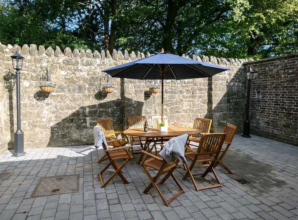 Paved patio area with outdoor furniture at Salomons Country Cottage in Tunbridge Wells, Kent