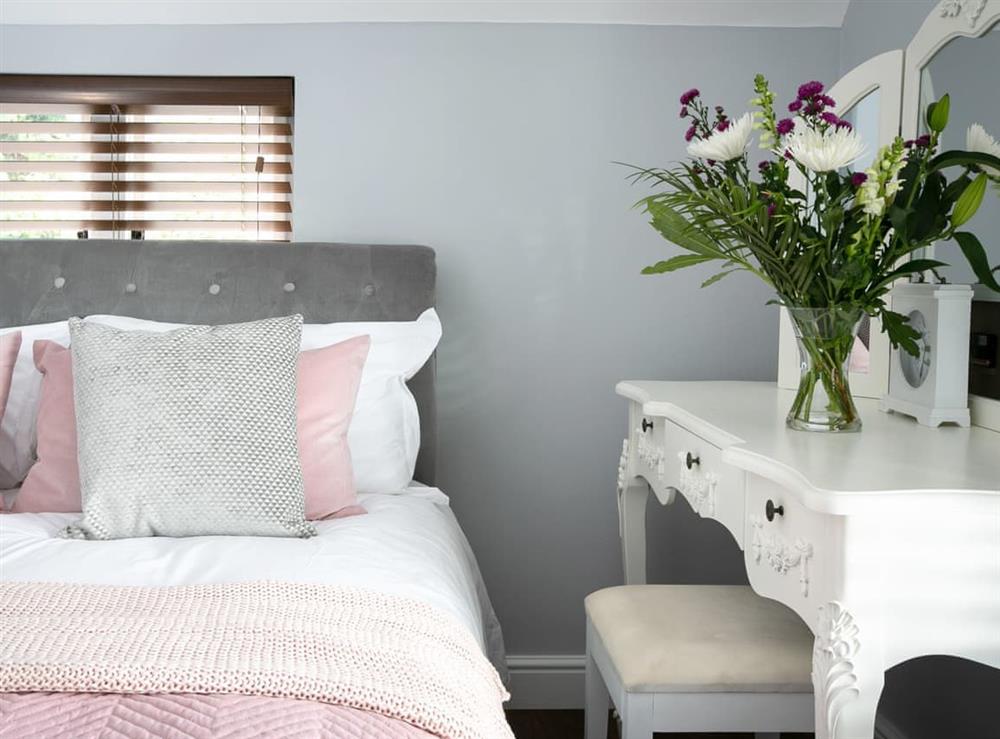 Stylish master bedroom at Salomons Country Cottage in Tunbridge Wells, Kent