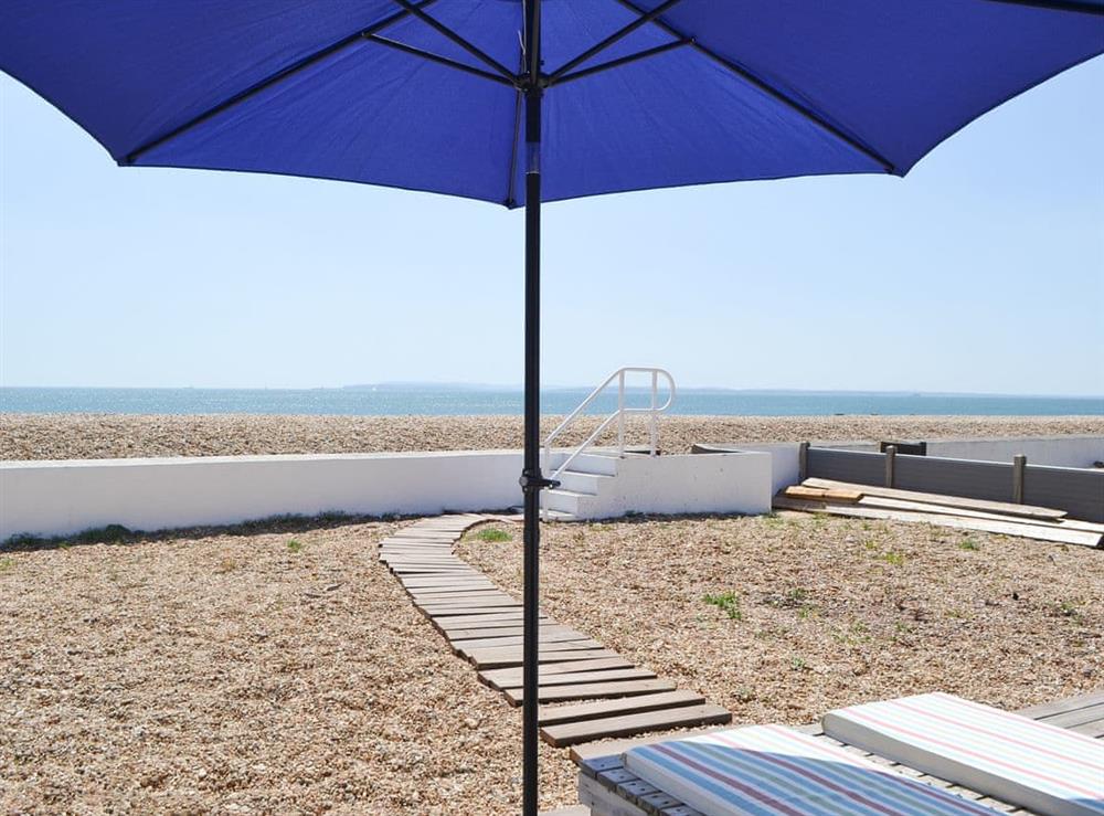 Enclosed beach garden with easy access to beach at Salty Lodge in Hayling Island, Hampshire