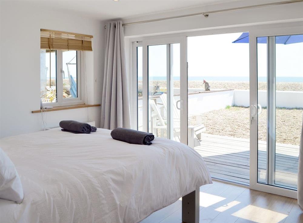 Peaceful Master bedroom with Patio door to patio at Salty Lodge in Hayling Island, Hampshire