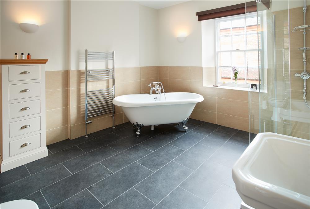 Bathroom with elegant roll top bath and separate shower (photo 2) at Salutation Apartment, Netherby Hall, Longtown