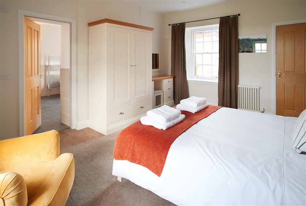 Bedroom with a 5’ king-size bed (photo 2) at Salutation Apartment, Netherby Hall, Longtown