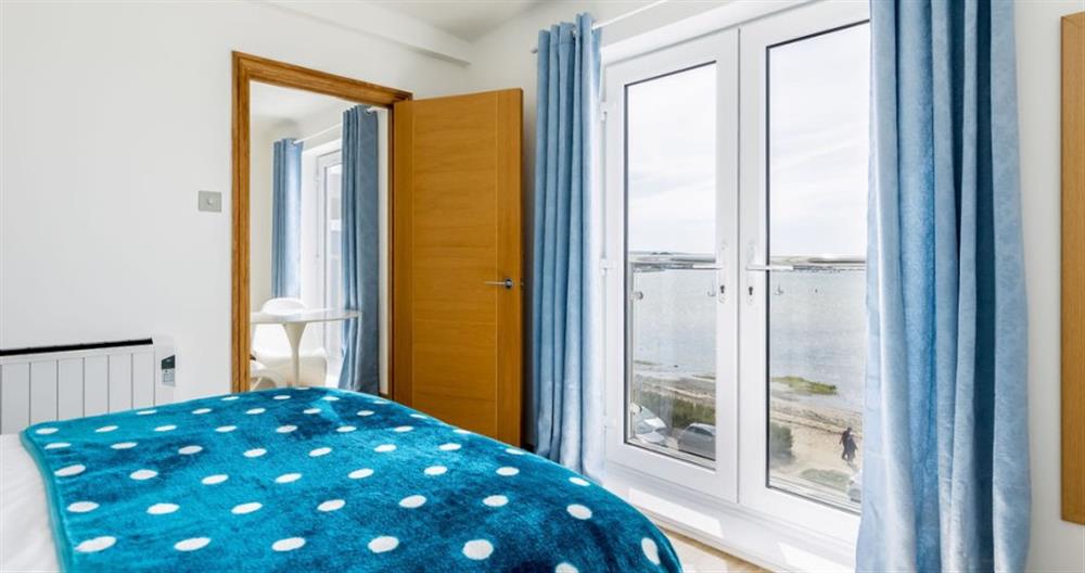 This is a bedroom at Sandacres No.22 in Sandbanks