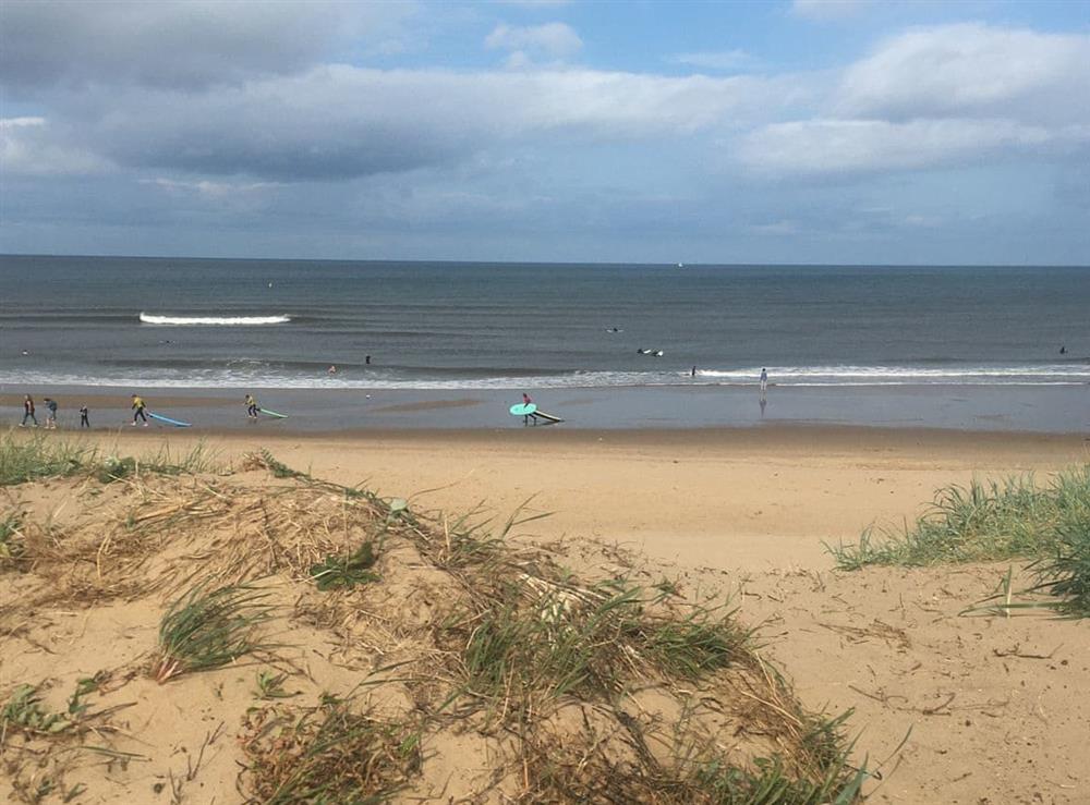 Surf school at near by beach at Sandancer in South Shields, Tyne and Wear