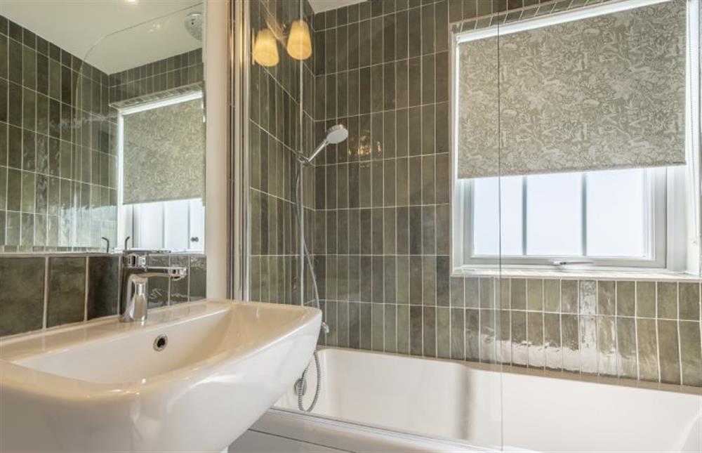Master bathroom with bath and shower over (photo 2) at Sandbank, Hunstanton