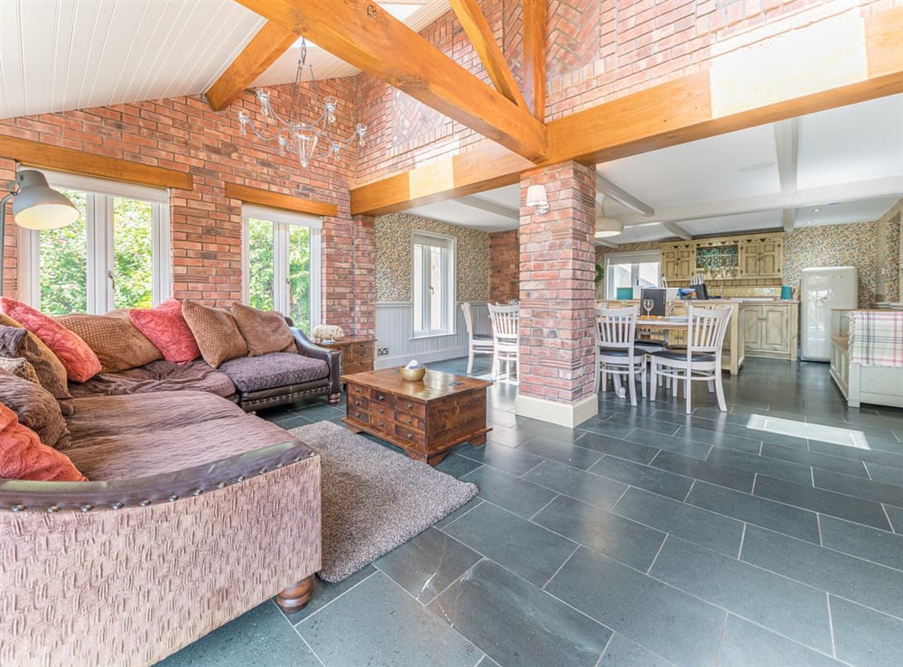 Open plan living space at Sandbeds Farmhouse in Kendal, Cumbria