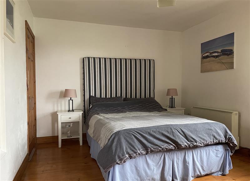 A bedroom in Sandeel Bay at Sandeel Bay, Hookless Village near Fethard-On-Sea