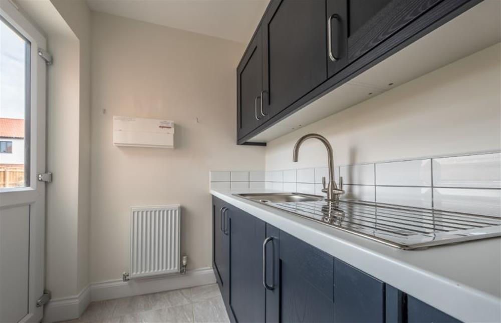 A useful utility with laundry facilities and door to the garden (photo 2) at Sandpiper House, Ingoldisthorpe near Kings Lynn
