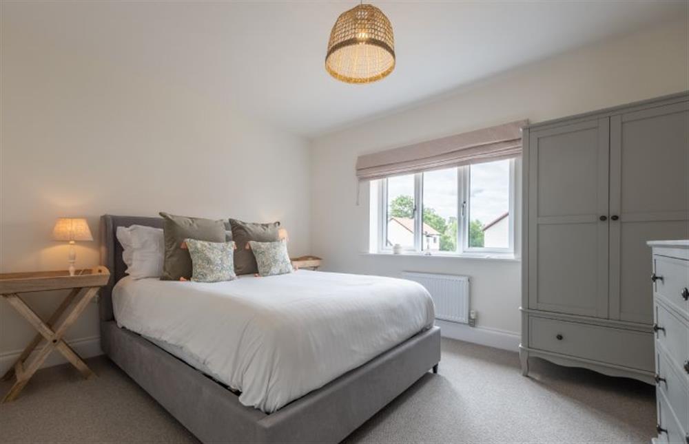 Bedroom two with 5’ king-size bed at Sandpiper House, Ingoldisthorpe near Kings Lynn