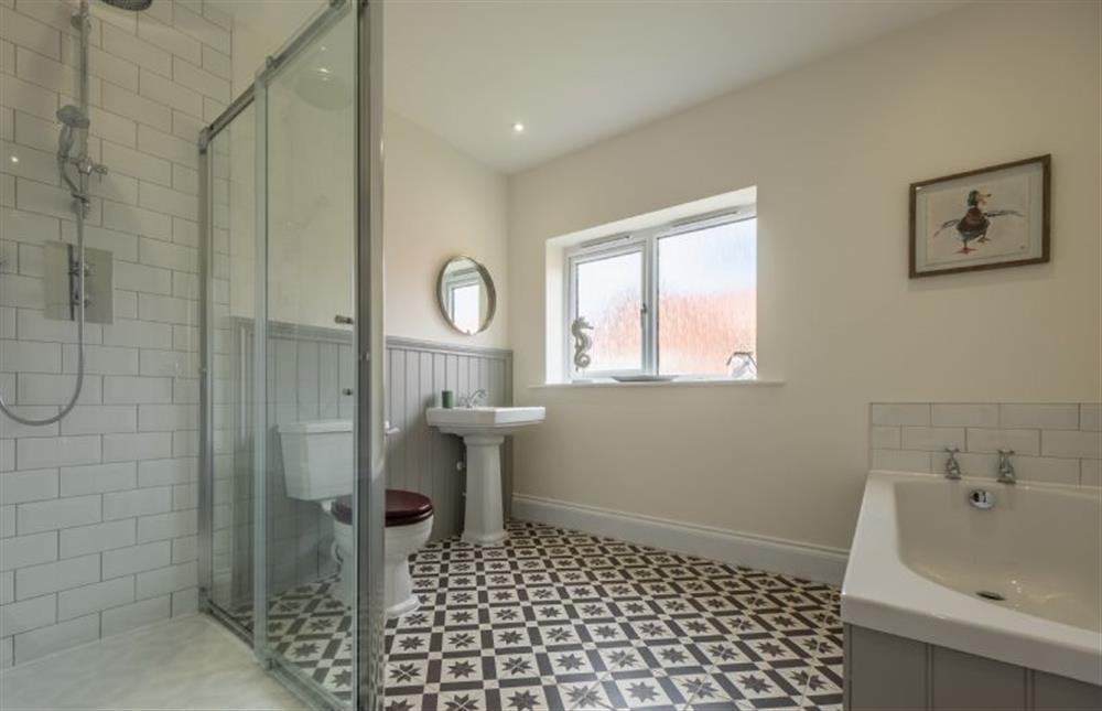Family bathroom with bath and shower cubicle at Sandpiper House, Ingoldisthorpe near Kings Lynn