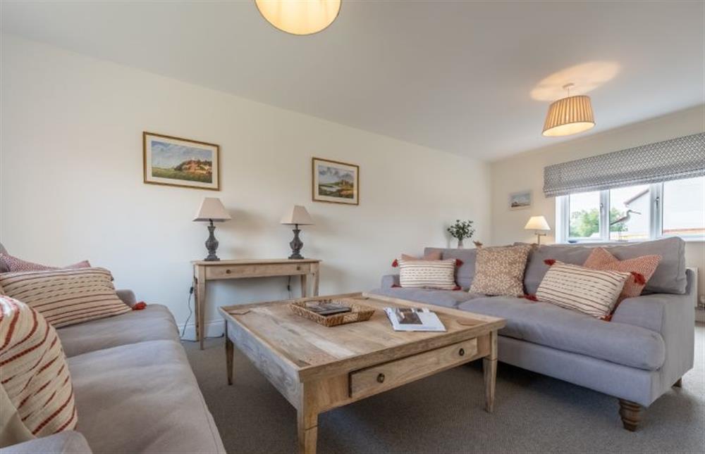 Sitting room with cosy sofas (photo 2) at Sandpiper House, Ingoldisthorpe near Kings Lynn