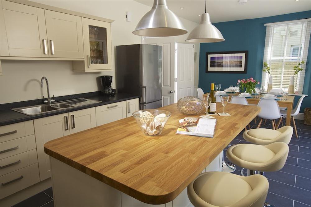 A beautifully hand-crafted kitchen has cream units at Sandpiper in , Salcombe