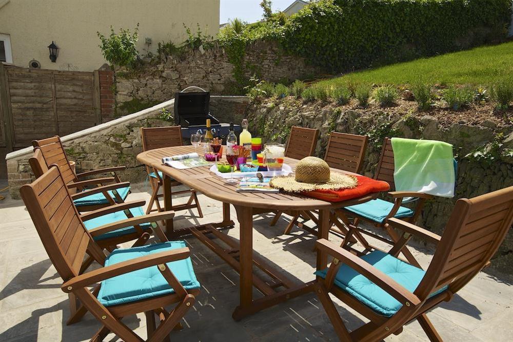 Private terrace with table, chairs and gas barbeque