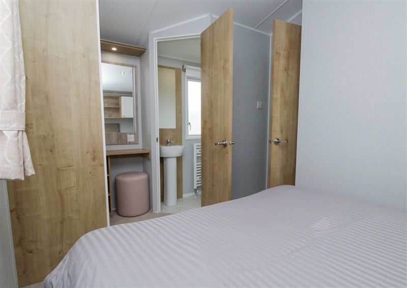 A bedroom in Sandpiper at Sandpiper, St Bees